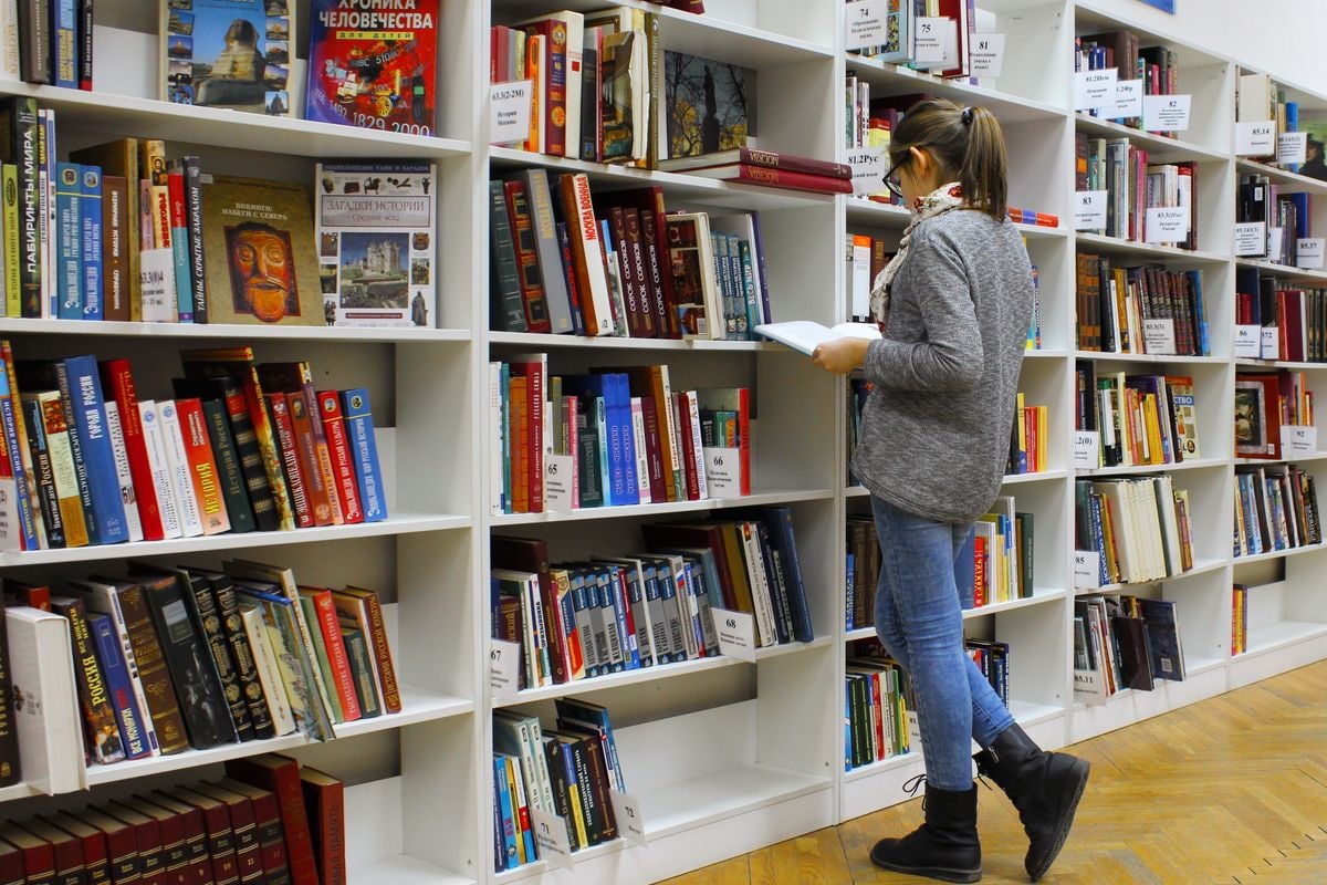Library aisle with shelves and reading light
